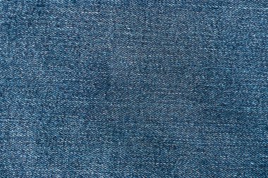 Kot pantolon dokusunun en üst görüntüsü. Detaylı mavi rengin tuval pantolonu