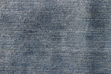 Kot pantolon dokusunun en üst görüntüsü. Detaylı koyu mavi renkli tuval pantolonu