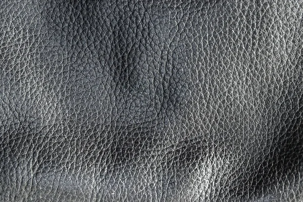 Abstrakte echtes schwarzes Leder Textur Hintergrund Nahaufnahme — Stockfoto