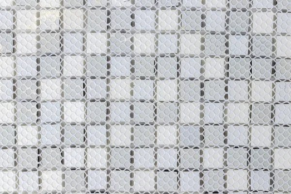 back side of White, Grey and black ceramic mosaic wall tiles texture for bathroom, abstract background for copy space, top view