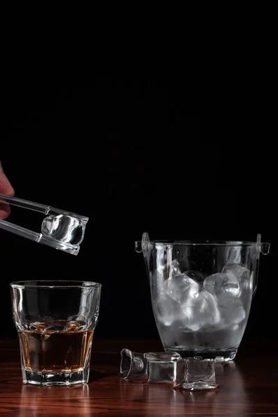 Hand Tongs Holding Ice Cube Glass Whiskey Ice Bucket Alcoholic — Stock Photo, Image