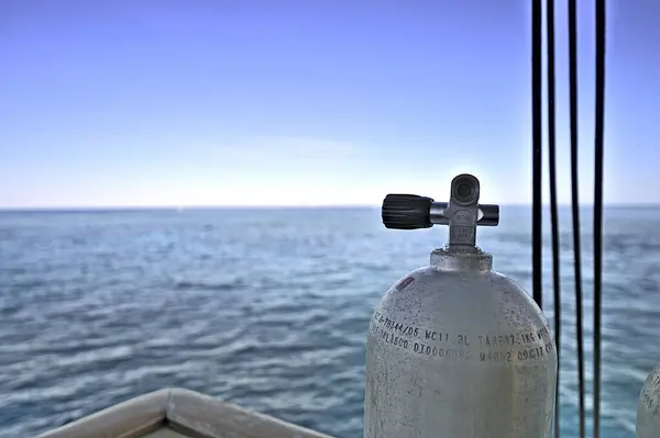 Tank on a dive boat with view on the Great Barrier Reef