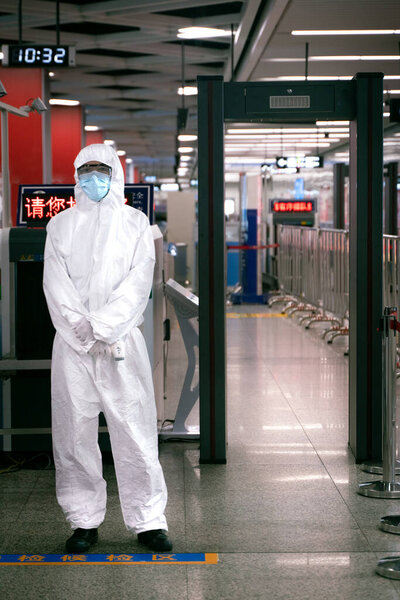 The coronavirus and luggage check post on the entrance in the subway.
