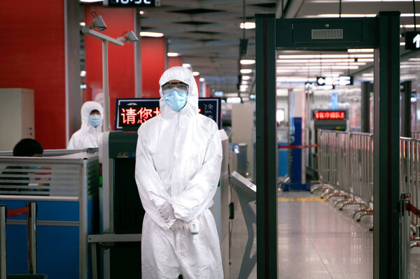 The coronavirus and luggage check post on the entrance in the subway.