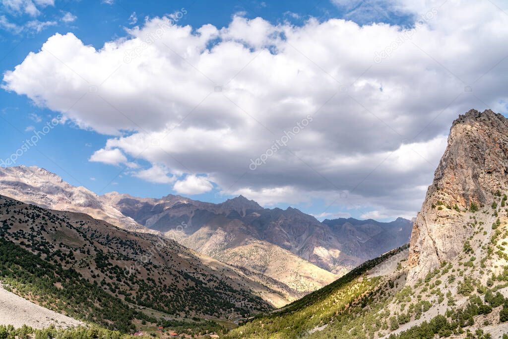 The beautiful mountain trekingtrekking road with clear blue sky and rocky hills in Fann mountains in Tajikistan