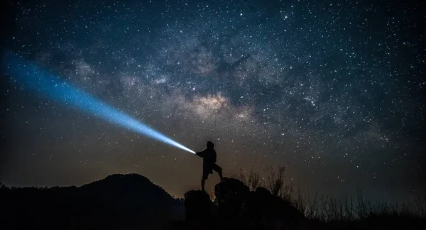 Star-catcher. A person is standing next to the Milky Way galaxy — Stock Photo, Image