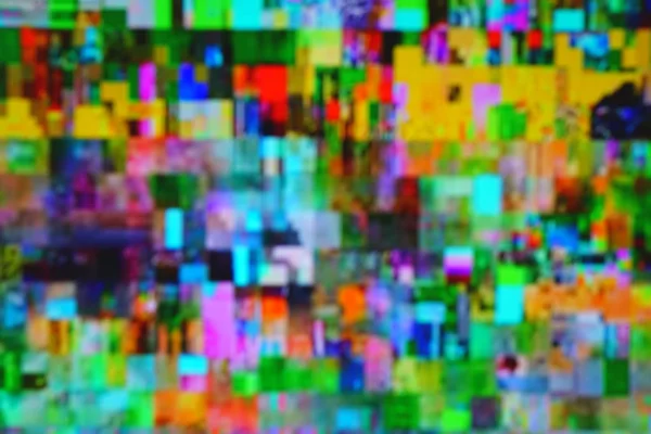 A Blurred Photo of Multi Coloured Pixels, Showing the Distorted and Random Shapes of a Cube.