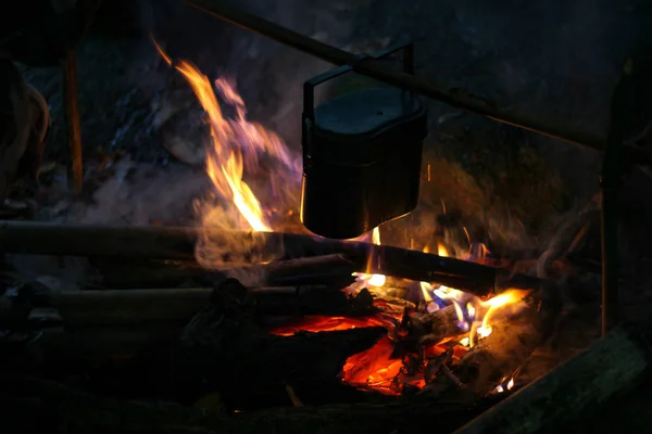 Rice cooking with a military field pot.