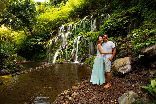 Happy multiracial couple hugging and admiring nature. Couple in