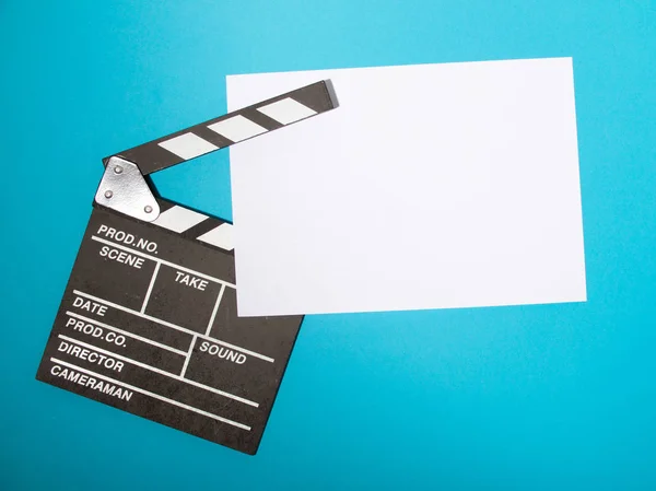 Movie production clapper board isolated on blue background. movie clapper isolated on blue. film making production. empty space for text