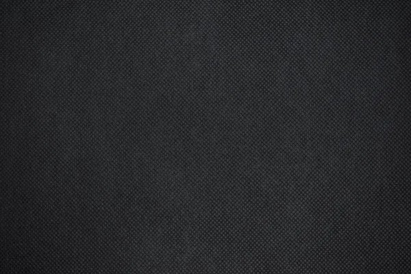 要旨黒の生地の質感の背景や、ビネット効果のある濃いグレーの布のテクスチャの背景 — ストック写真