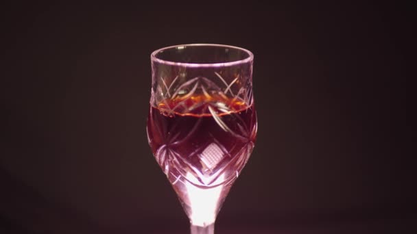 Glass Red Wine Black Background Color Cast — Stock Video