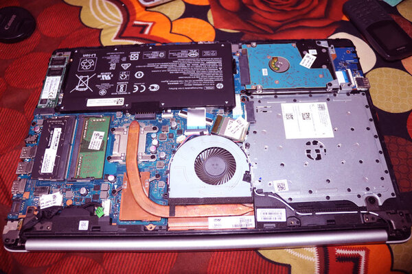 Laptop All Parts when uncover.Laptop Battery,Processor,Hard disk,Ram and Fan.Computer repair.Electronic service center.Technician support upgrade part and fixing laptop.