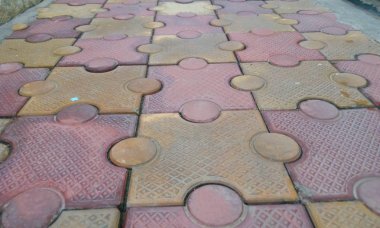 closeup image of 80 mm thick interlocking tile flooring laid outside of an residential building clipart