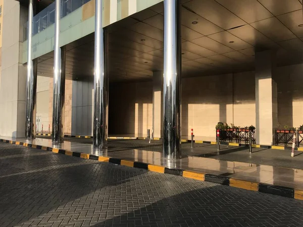 Concrete filled stainless steel finished tubular columns in an entrance of an Big shopping mall construction exterior finishes for an lucrative finishes