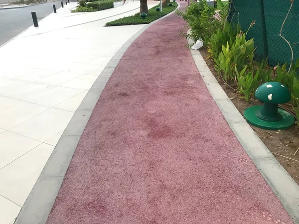 One meter wide rubber flooring for walking jogging and running at an outdoor park physical activities