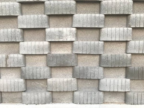 Concrete block wall constructed for Public toilet in Three dimensional view like in and out pattern using blocks cement and sand bond