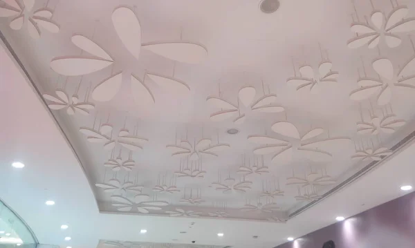 Gypsum false ceiling and coves for indirect lighting in which beautiful flora designs are made with some light materials which will give nice looks once the light switched on