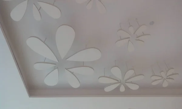 Gypsum false ceiling and coves for indirect lighting in which beautiful flora designs are made with some light materials which will give nice looks once the light switched on