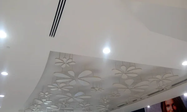 Gypsum false ceiling and coves for indirect lighting in which beautiful flora designs are made with some light materials which will give nice looks once the light switched on