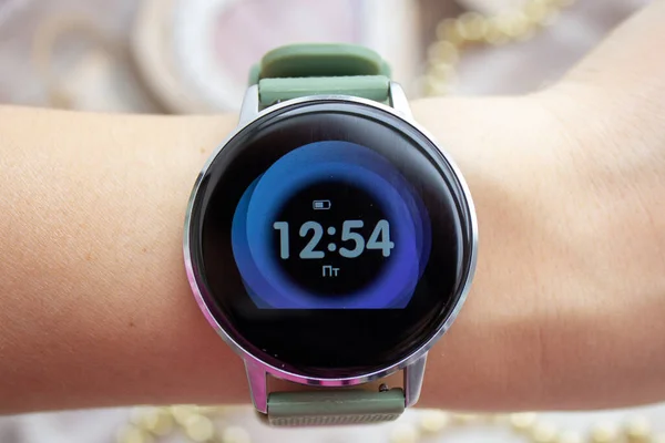 Digital watch with a large display on the girl s hand
