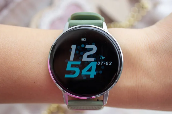 Digital watch with a large display on the girl s hand