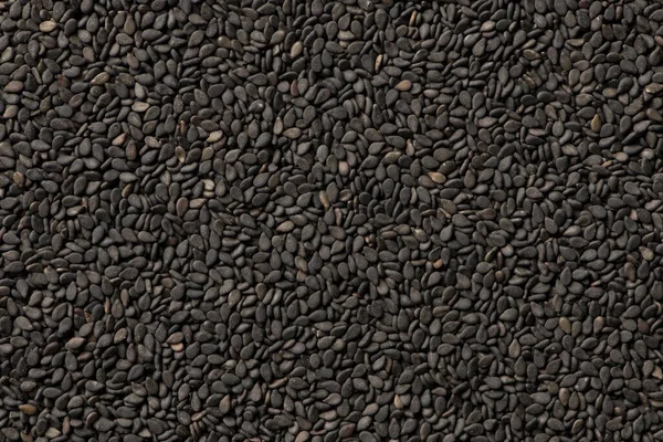 Siyah Susam Tohumları Arka Planı Kapatın — Stok fotoğraf