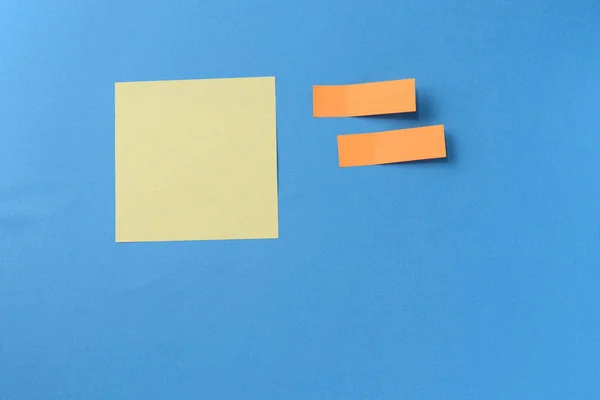Sticker notes on a blue background with copy space. Business concept, horizontal mock-up