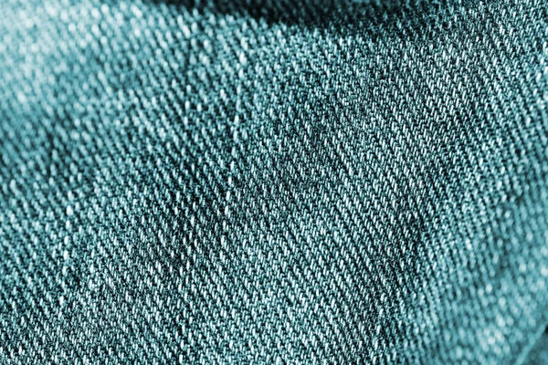 Toned denim texture close-up. Jeans background