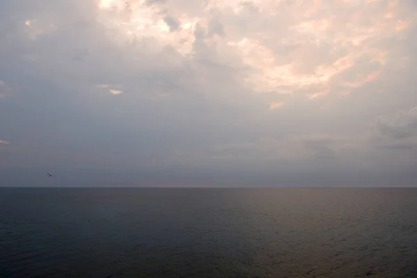 Overcast sky over the sea on a summer evening near the coast of Sicily. Natural background