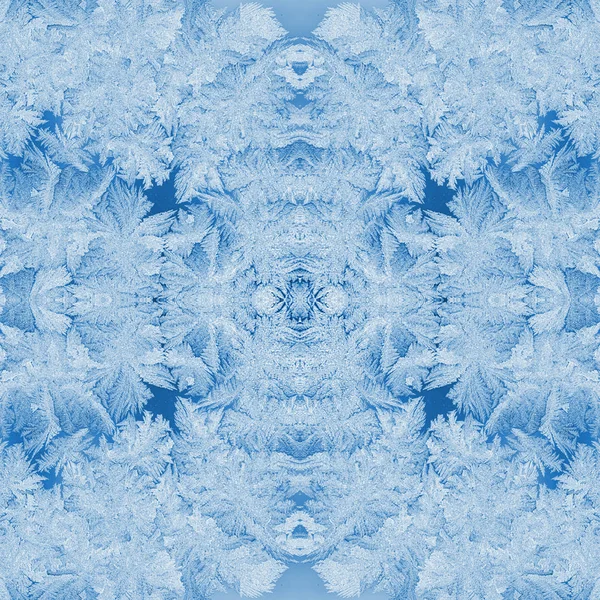 Magnificent kaleidoscope of many frosty patterns in trendy 2020 Classic Blue as Christmas festive natural background.