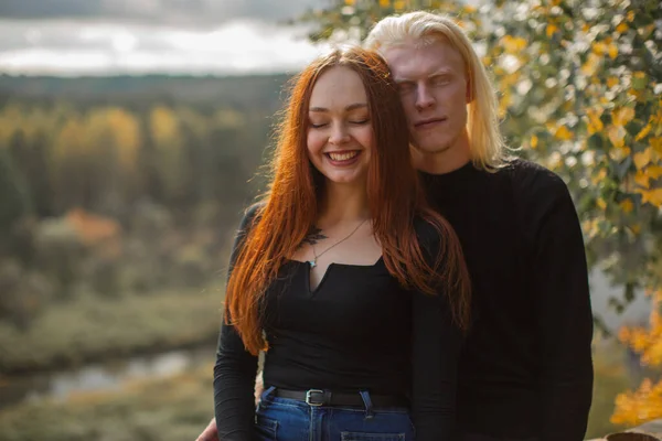 Young albino couple and redhead in nature against the backdrop of the forest — Stock Photo, Image