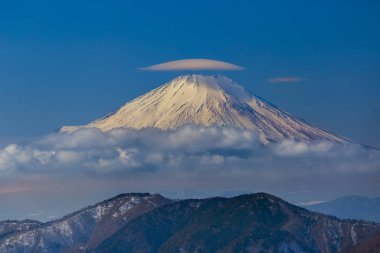 Lenticular cloud on the top of Fuji-san. Photo was taken from Tanzawa ranges. clipart