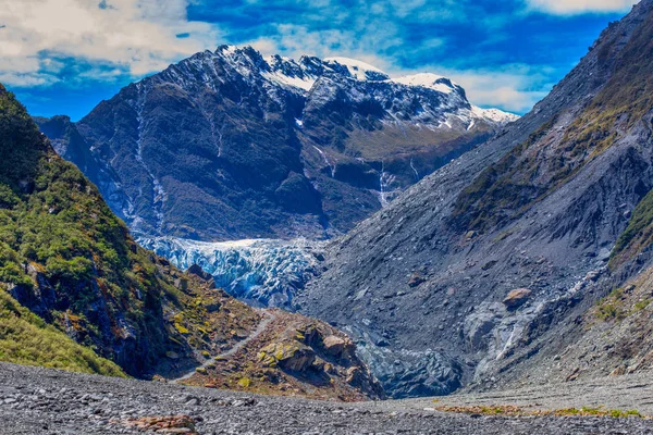 Fox Glacier Valley, with Fox Glacier itself and  Kirikirikatata / Mount Cook Range on the background.