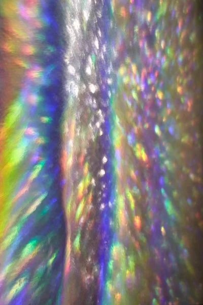 Abstract blurred hologram background.Rainbow holographic foil background.Background illusion.