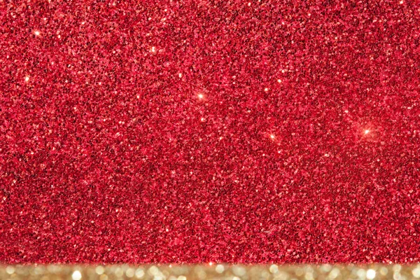 Glänzend roter Hintergrund mit beigem Streifen. Weihnachtskarte. Lichterglanz. Schöne helle Urlaub abstrakte rote Glitzertextur. Leuchtender Hintergrund. Roter Stern glitzert Sandpapier Textur abstrakt. — Stockfoto