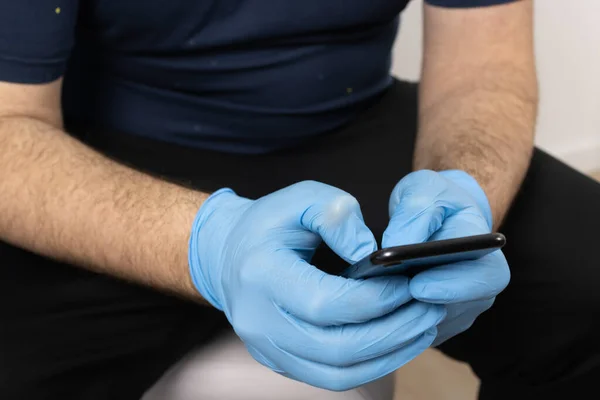 Man Hands Gloves Using Cell Phone — Stock Photo, Image