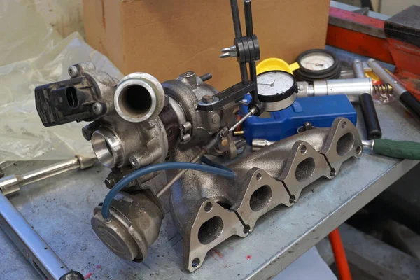 Turbocharger repair in service using precision measuring instruments.  
