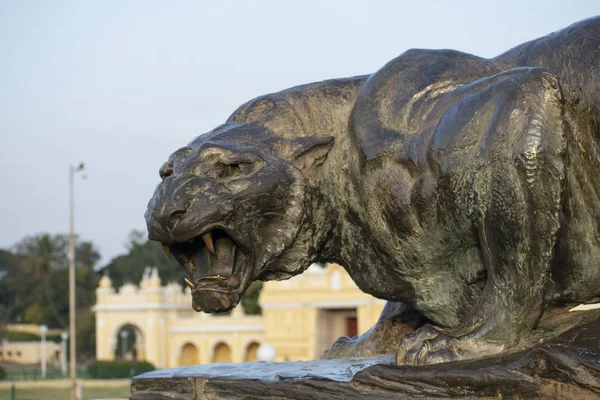 A statue of a ferocious tiger made of bronze Royaltyfria Stockfoton