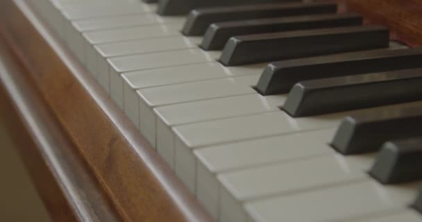 Tracking shot of piano keys — Stock Video