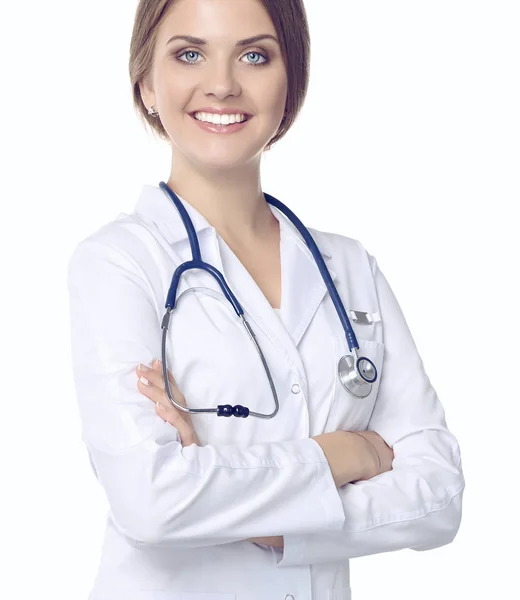 Retrato de una joven doctora con una bata blanca de pie — Foto de Stock