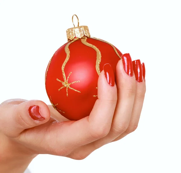 Kerstdecoratie in de hand, geïsoleerd op witte achtergrond — Stockfoto
