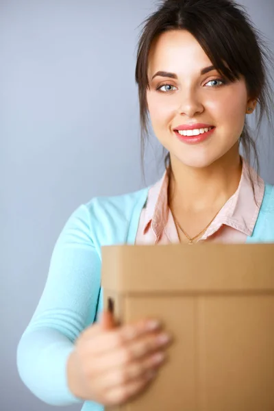 Portrait of pretty woman holding a box — Stock Photo, Image