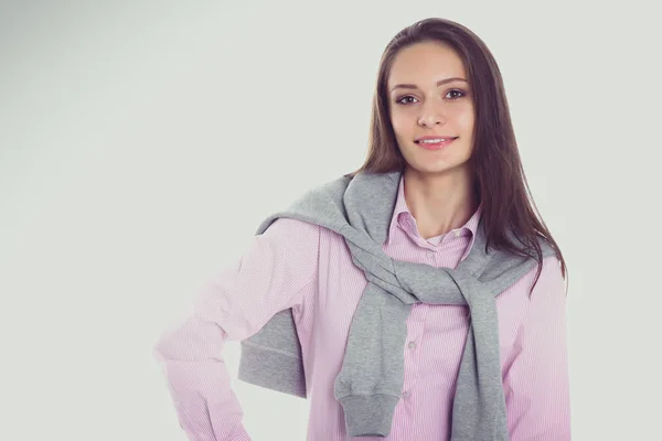 Jonge vrouw staan op de witte achtergrond — Stockfoto