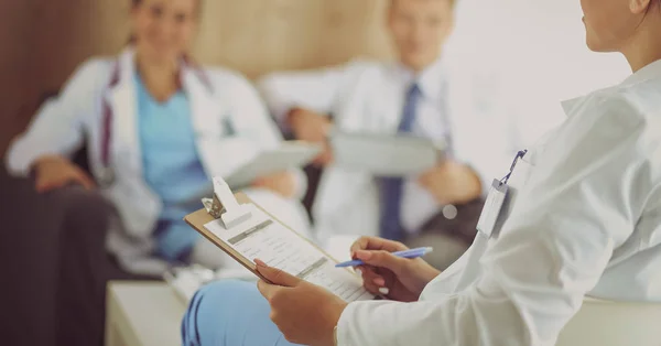 Happy medical team discussing and working together — Stock Photo, Image