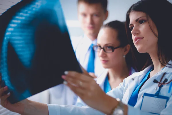 Young group of doctors looking at x-ray — Stock Photo, Image