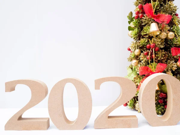 2020 wooden character and Christmas tree with decoration on white background, Have a nice holiday on this Christmas and New Year