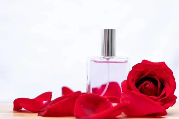 Essential oil, Rose flower, Rose perfume on white background, spa aromatherapy.