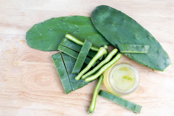 Cactus leaves, gel and cactus leaves slide Isolated on wooden background.