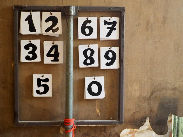 Arabic numbers on old wooden board.Let\'s count the numbers.